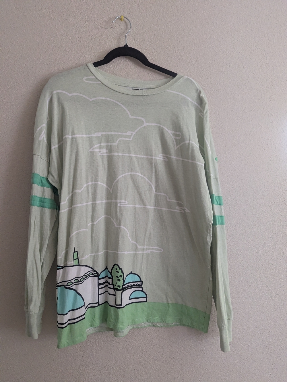 Spirit Jersey-Light Green Graphic Long Sleeve Top with Sky and City Motif